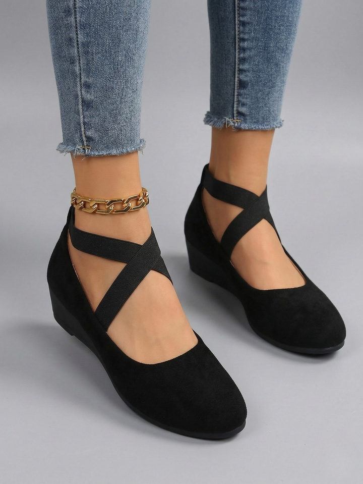 Women's black and beige closed-toe platform wedge shoes with elastic ankle strap