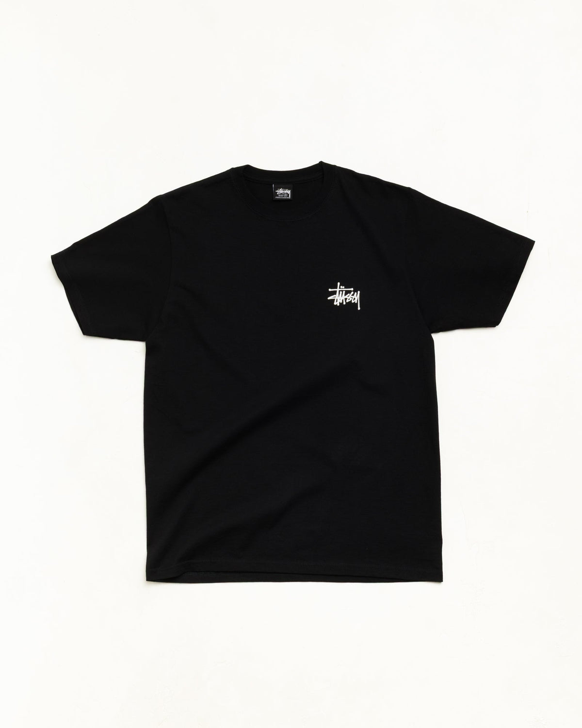 Men's black crewneck t-shirt with white Stüssy logo graphic