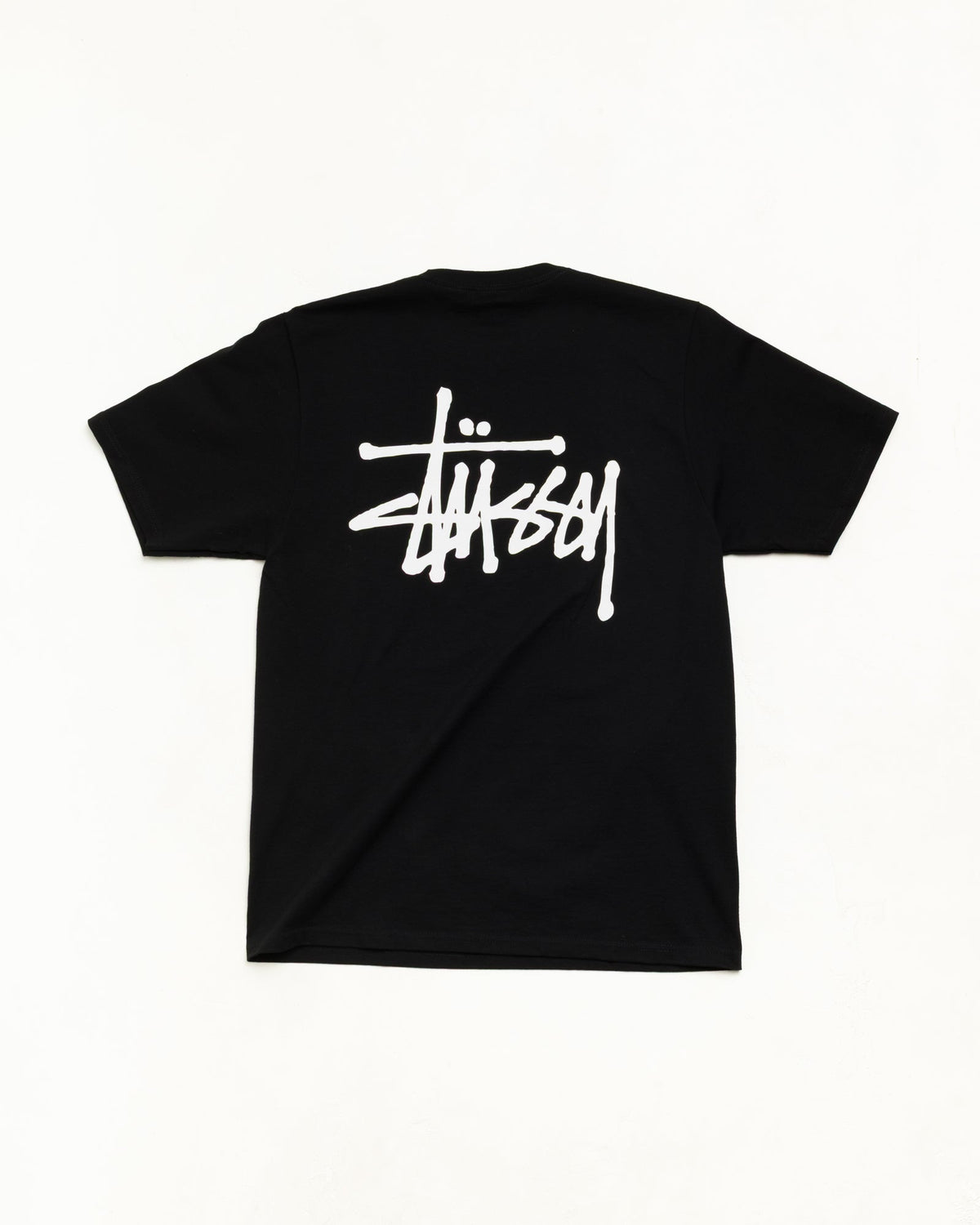 Men's black crewneck t-shirt with white Stüssy logo graphic
