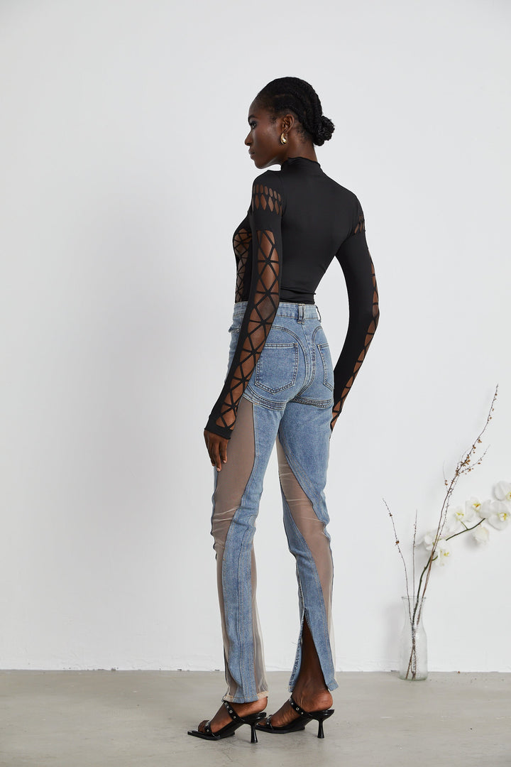 Women's blue jeans with sheer mesh panels at hips and thighs, high rise, fitted silhouette