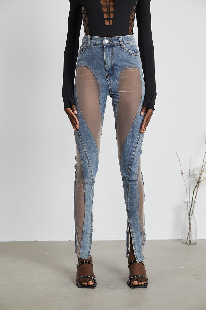 Women's blue jeans with sheer mesh panels at hips and thighs, high rise, fitted silhouette