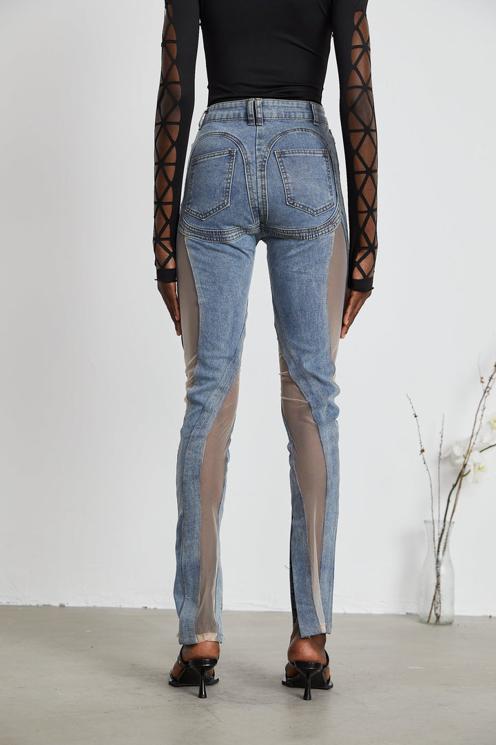 Women's blue jeans with sheer mesh panels at hips and thighs, high rise, fitted silhouette