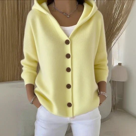 Women's pink and cream hooded cardigan with brown button front, shown in relaxed fit with pockets