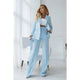 Women's light blue two-piece blazer suit with double-breasted jacket and straight trousers