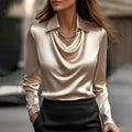 Women's shiny long-sleeve blouse with spread collar and cowl v-neck