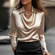 Women's shiny long-sleeve blouse with spread collar and cowl v-neck
