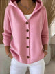 Women's pink and cream hooded cardigan with brown button front, shown in relaxed fit with pockets