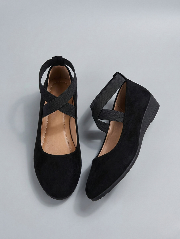 Women's black and beige closed-toe platform wedge shoes with elastic ankle strap