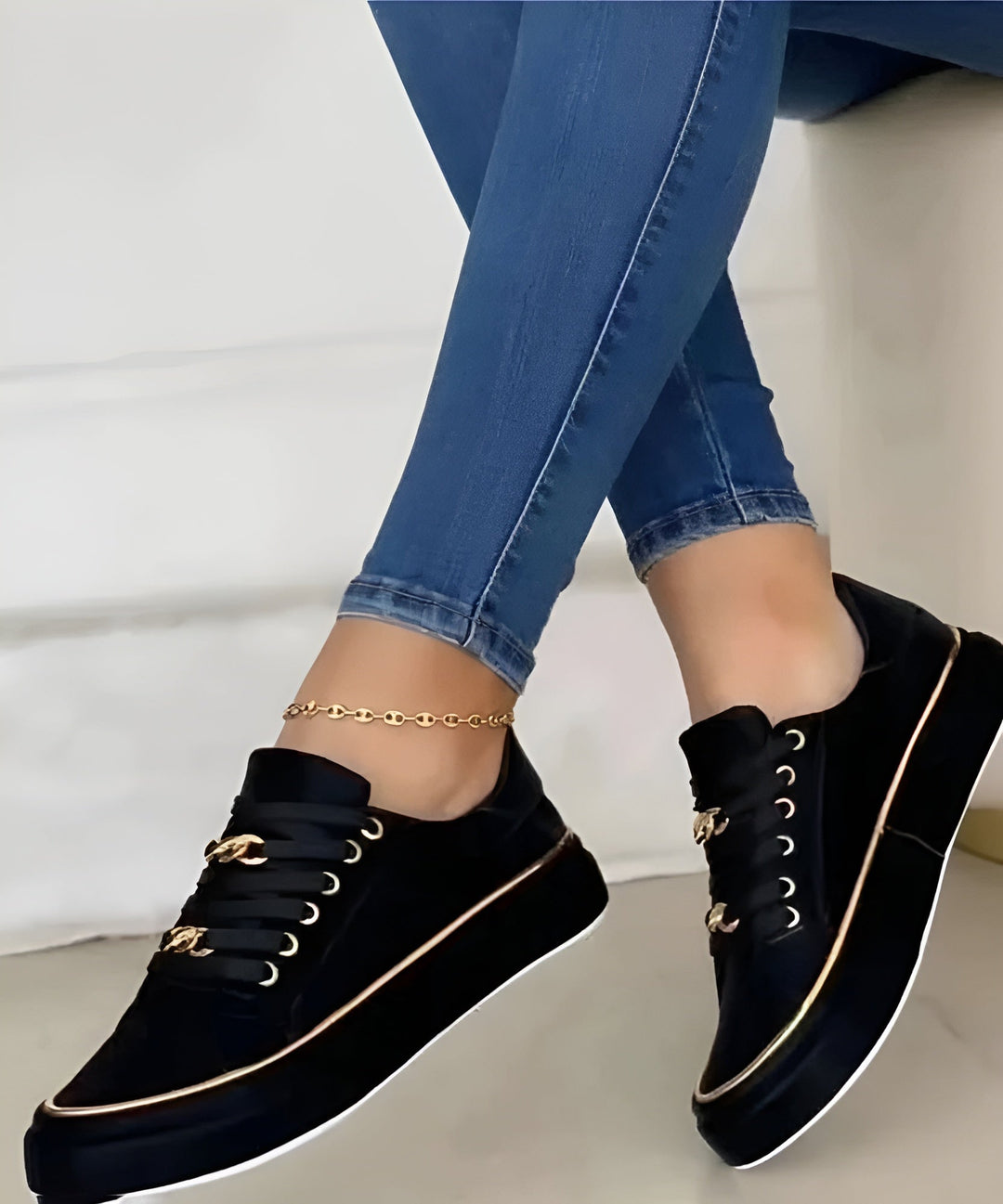 Women's low-top lace-up sneakers with decorative gold trim