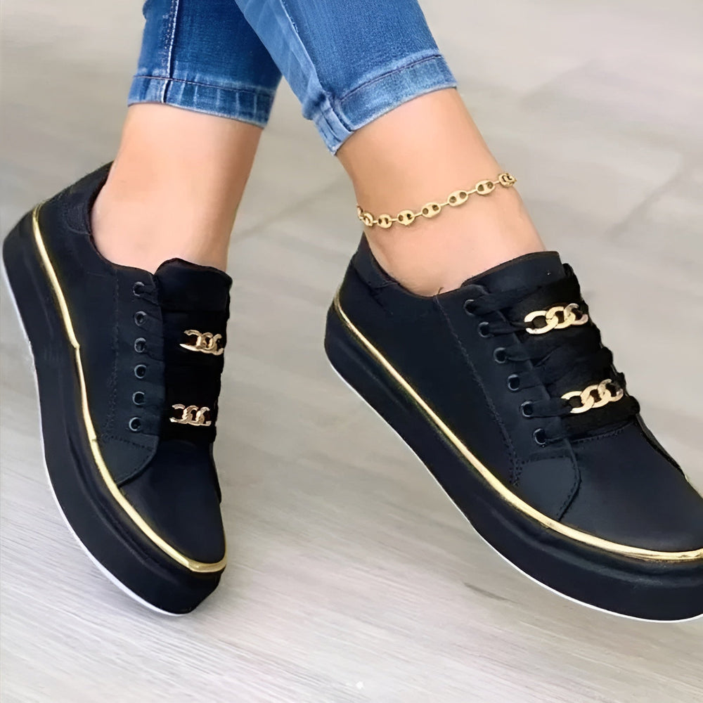Women's low-top lace-up sneakers with decorative gold trim