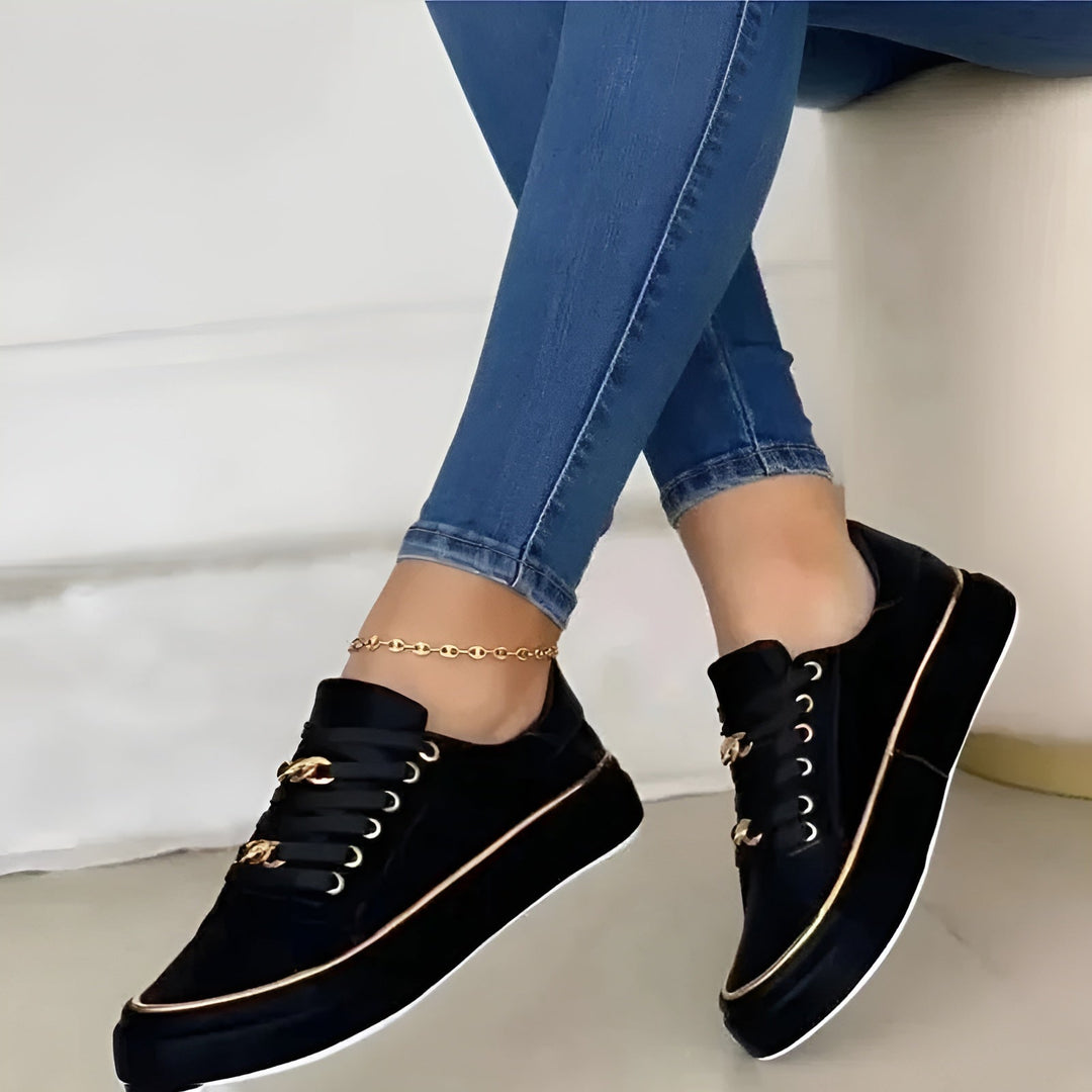 Women's low-top lace-up sneakers with decorative gold trim