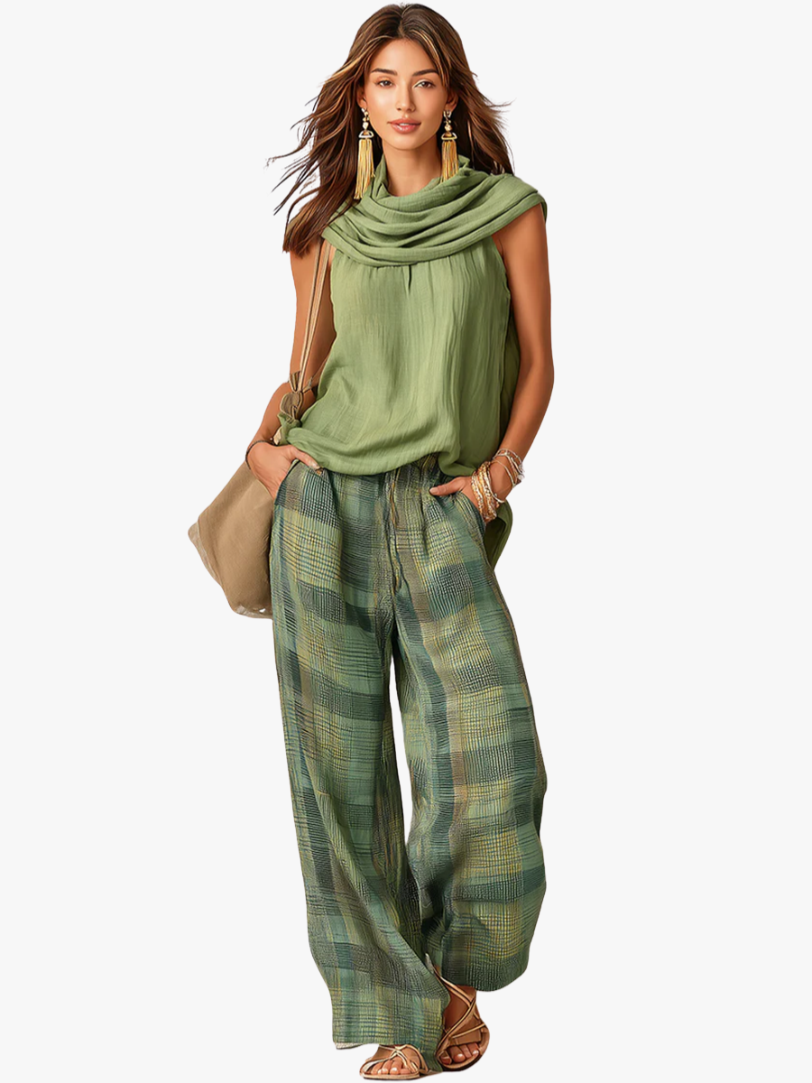 Women's sage green cowl neck top with green and gold checkered wide-leg trousers
