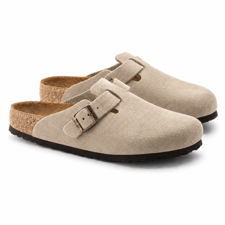 Unisex Positano clog mule with buckle strap, cork insole and black padded sole, shown in taupe and black.