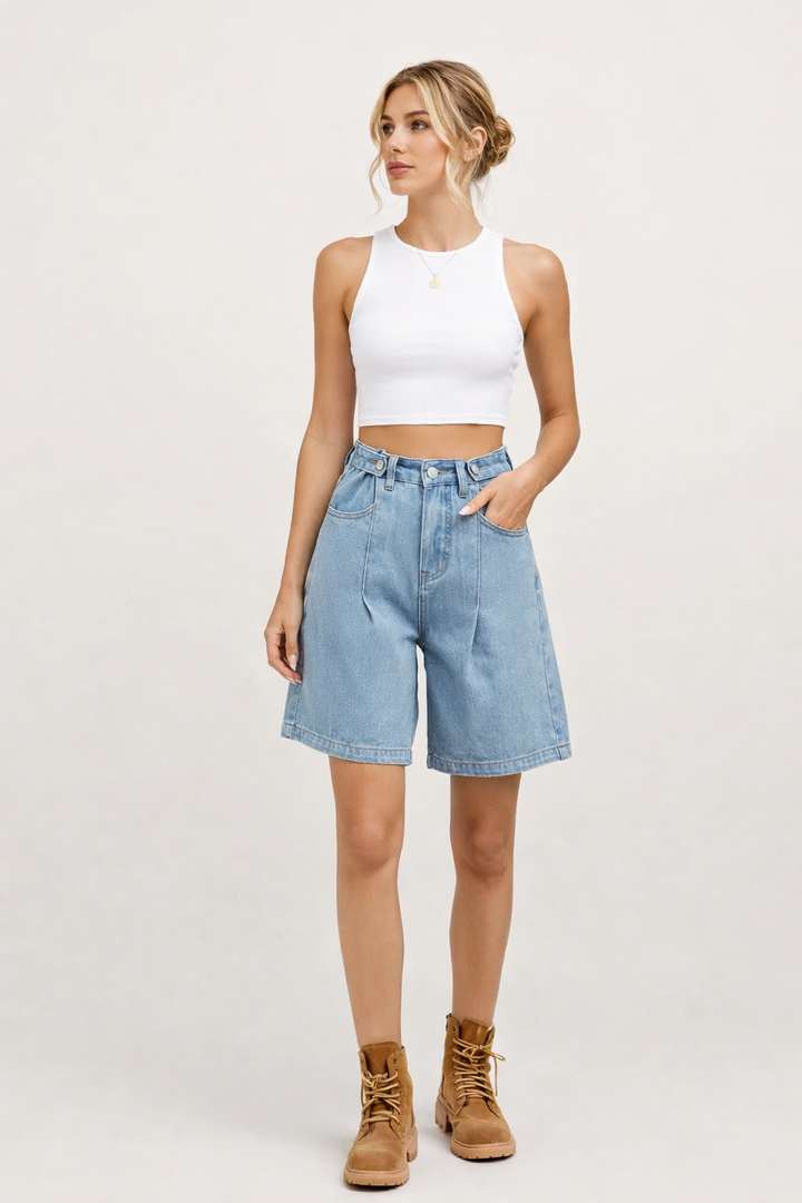 Women's high-rise wide-leg denim bermuda shorts in blue and black, shown with white tank top