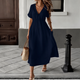 Women's white flowing maxi dress with V-neck tie-front and short puffed sleeves