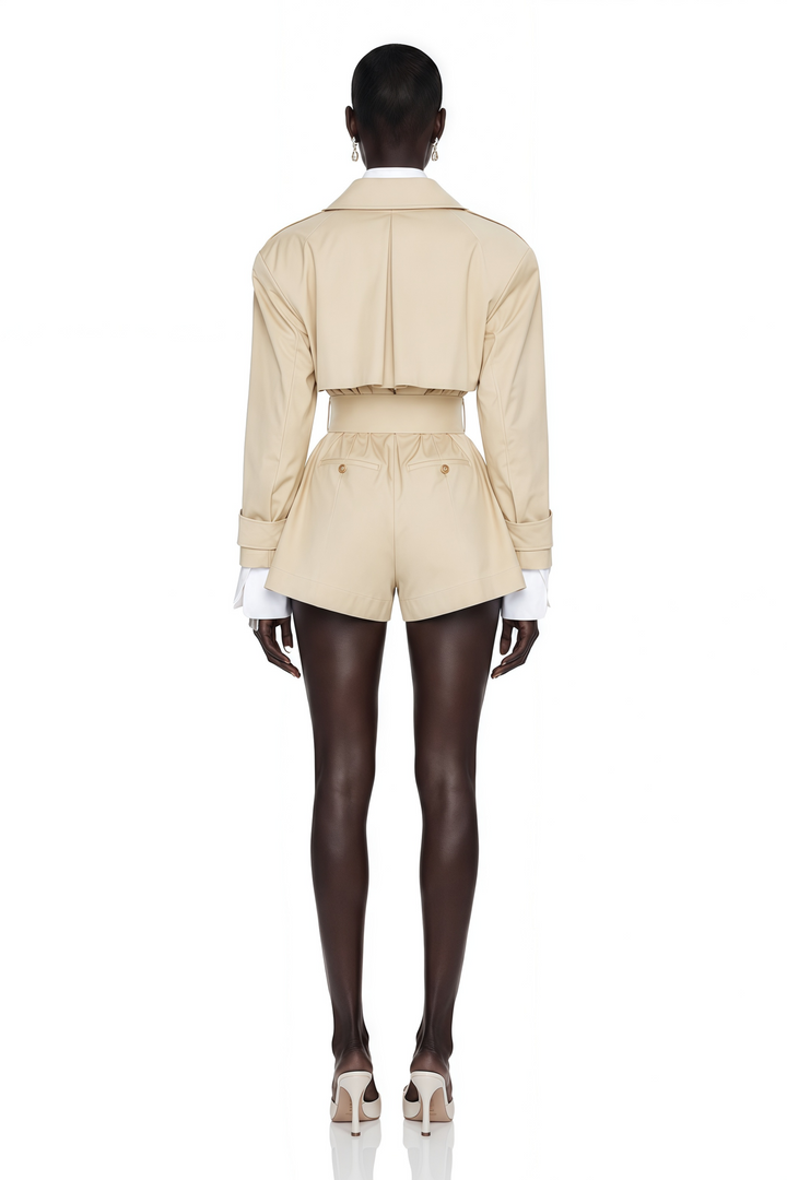 Women's beige belted trench playsuit with long sleeves and tailored shorts