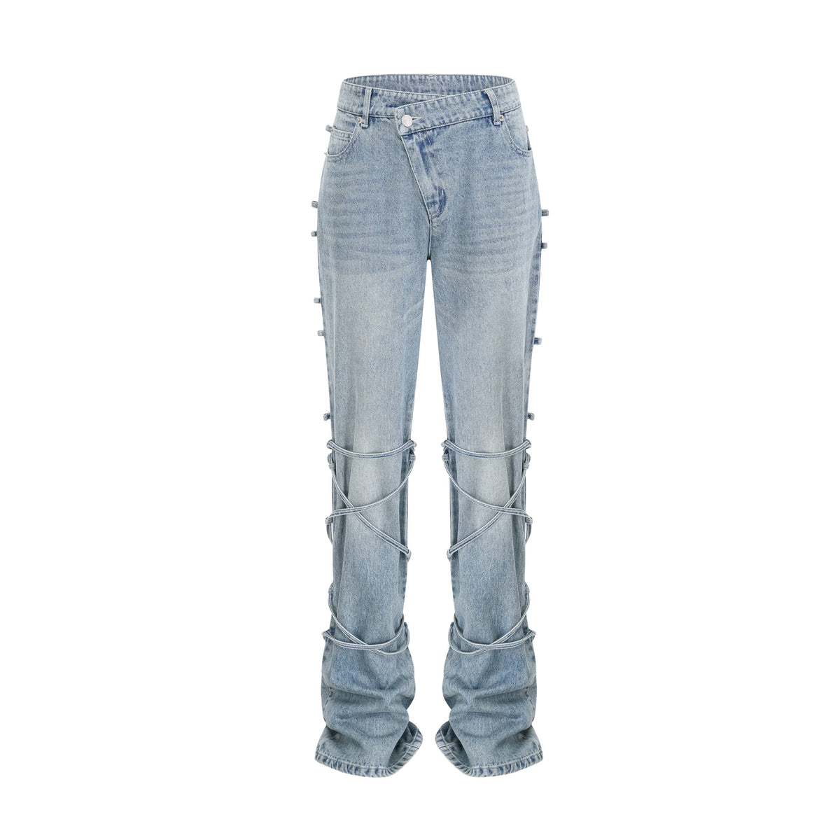Light wash blue jeans with layered strap details and tie-up cuffs on the lower leg