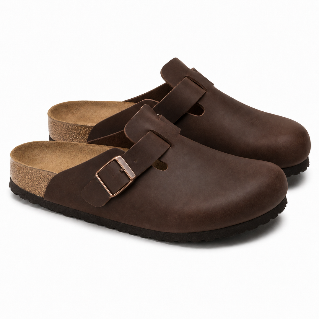 Unisex Positano clog mule with buckle strap, cork insole and black padded sole, shown in taupe and black.
