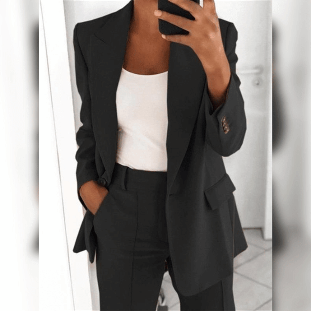 Women's two-piece tailored suit in black and blue, shown with white camisole layered underneath.