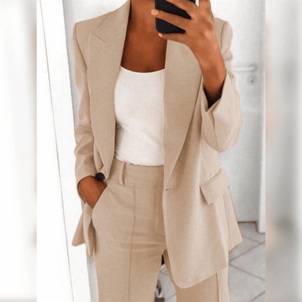 Women's two-piece tailored suit in black and blue, shown with white camisole layered underneath.