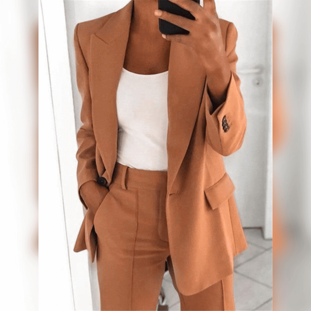Women's two-piece tailored suit in black and blue, shown with white camisole layered underneath.