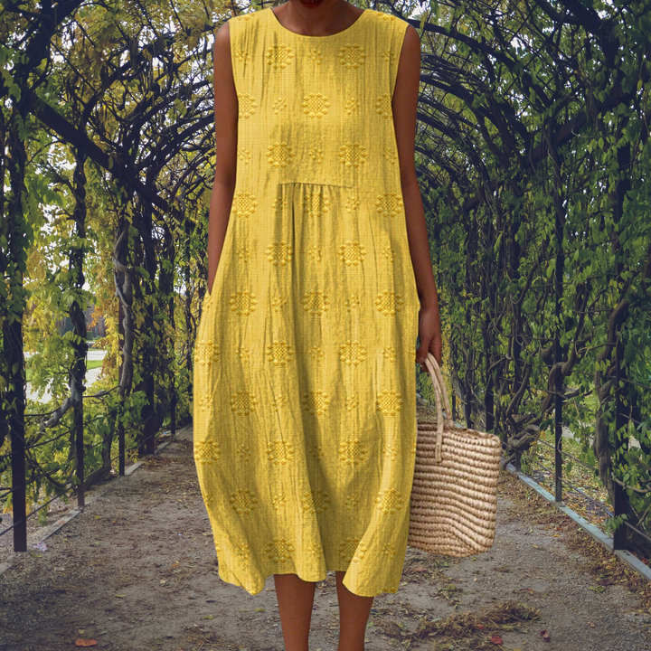 Sleeveless midi dress with raised embroidered dot motifs, round neckline and side pockets