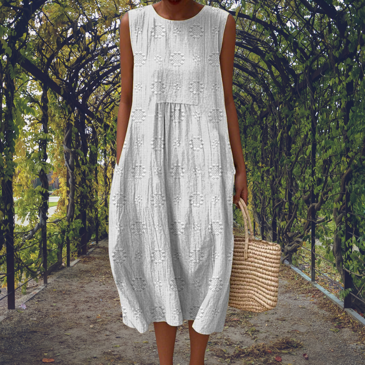 Sleeveless midi dress with raised embroidered dot motifs, round neckline and side pockets