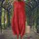 Sleeveless midi dress with raised embroidered dot motifs, round neckline and side pockets