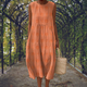 Sleeveless midi dress with raised embroidered dot motifs, round neckline and side pockets