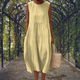 Sleeveless midi dress with raised embroidered dot motifs, round neckline and side pockets