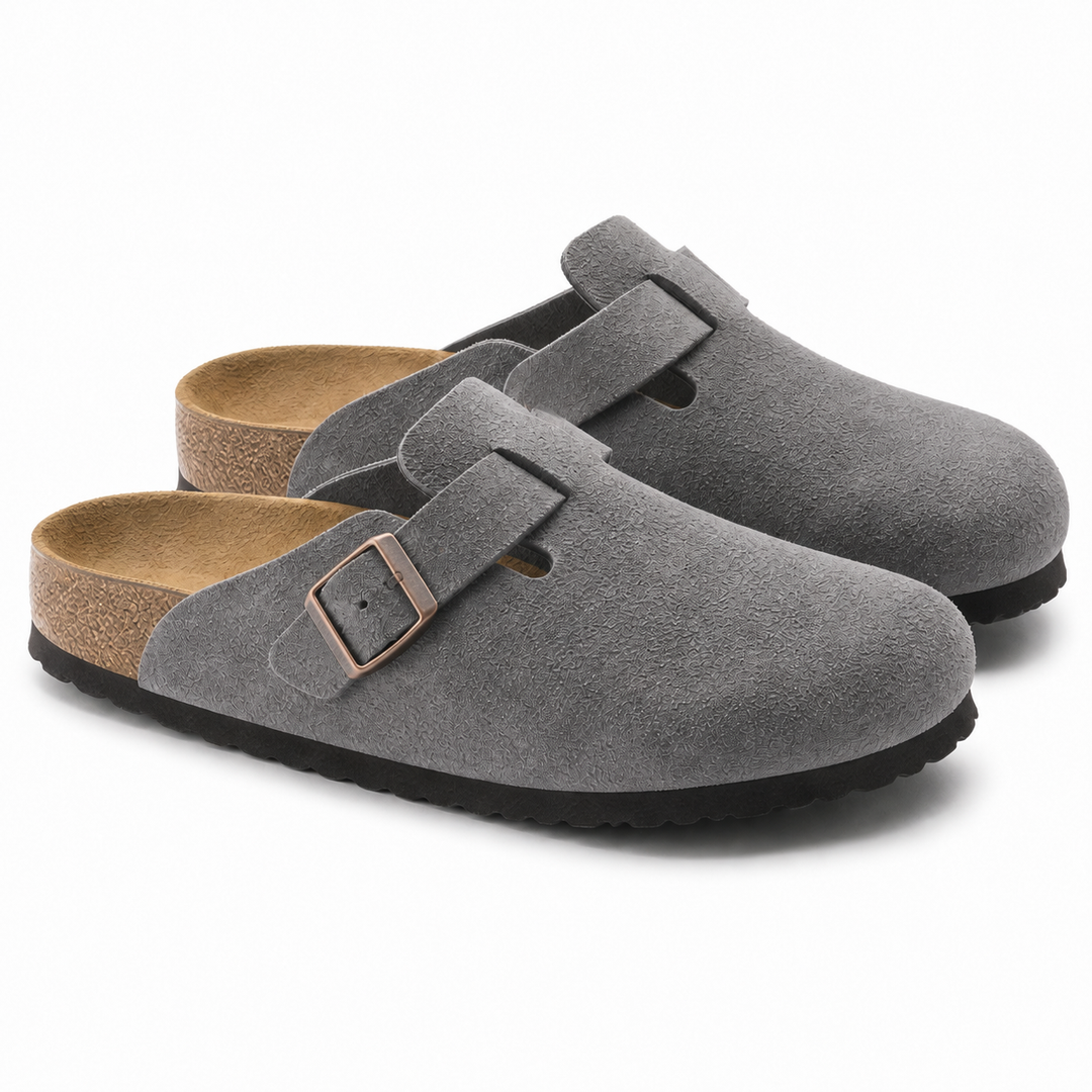 Unisex Positano clog mule with buckle strap, cork insole and black padded sole, shown in taupe and black.