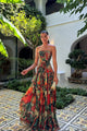 Woman wearing a strapless marbled swirl print maxi dress with a full gathered skirt