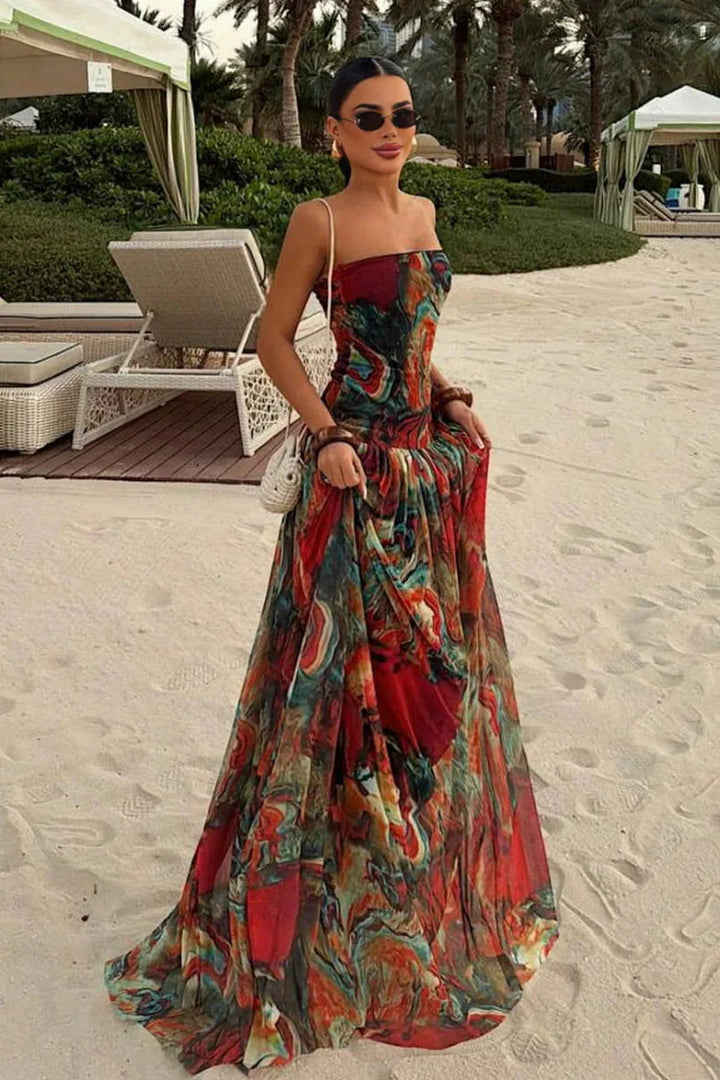 Woman wearing a strapless marbled swirl print maxi dress with a full gathered skirt