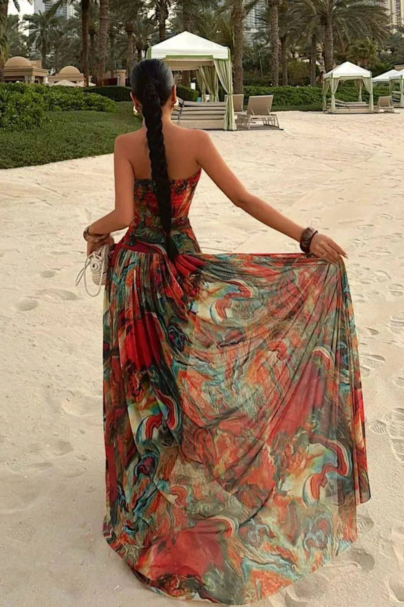 Woman wearing a strapless marbled swirl print maxi dress with a full gathered skirt