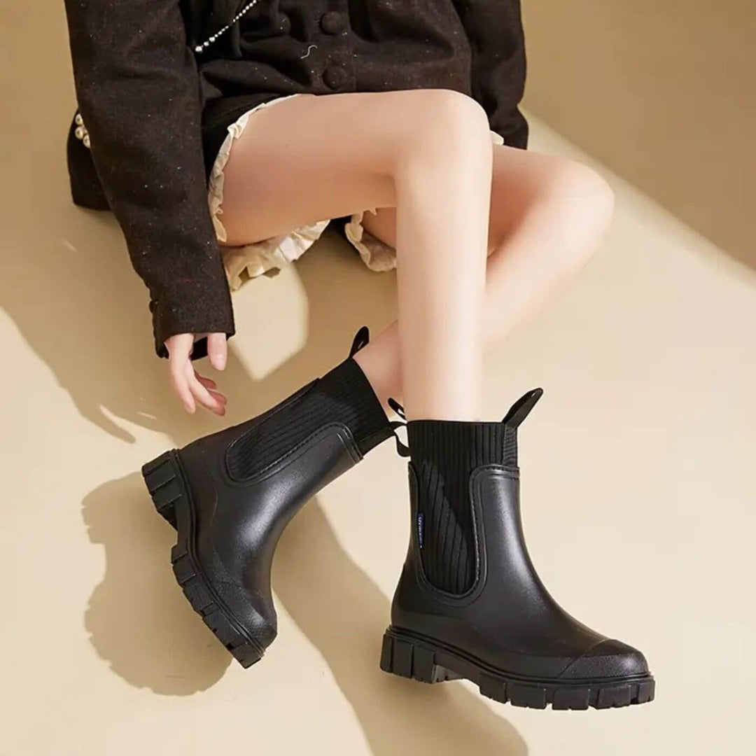 Women's waterproof Chelsea boots with pull tabs and lug sole