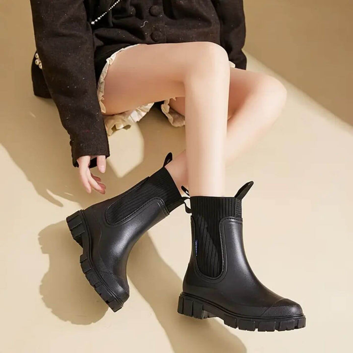 Women's waterproof Chelsea boots with pull tabs and lug sole