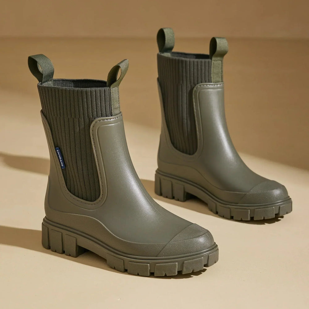 Women's waterproof Chelsea boots with pull tabs and lug sole