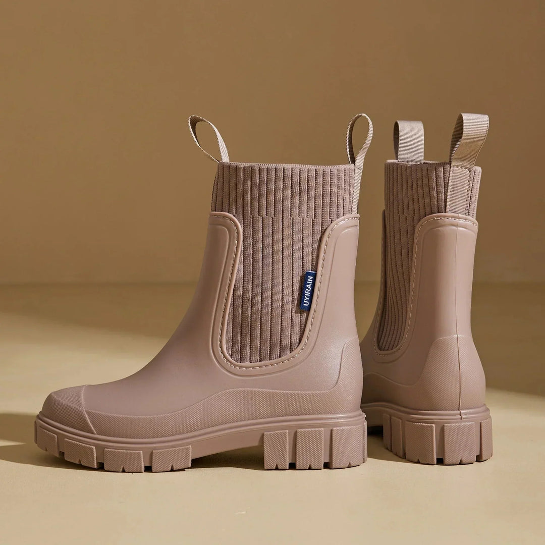 Women's waterproof Chelsea boots with pull tabs and lug sole