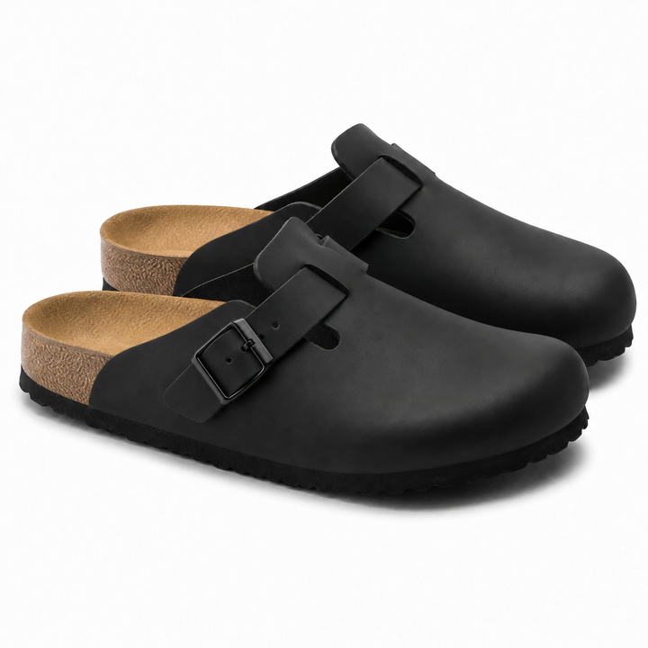 Unisex Positano clog mule with buckle strap, cork insole and black padded sole, shown in taupe and black.