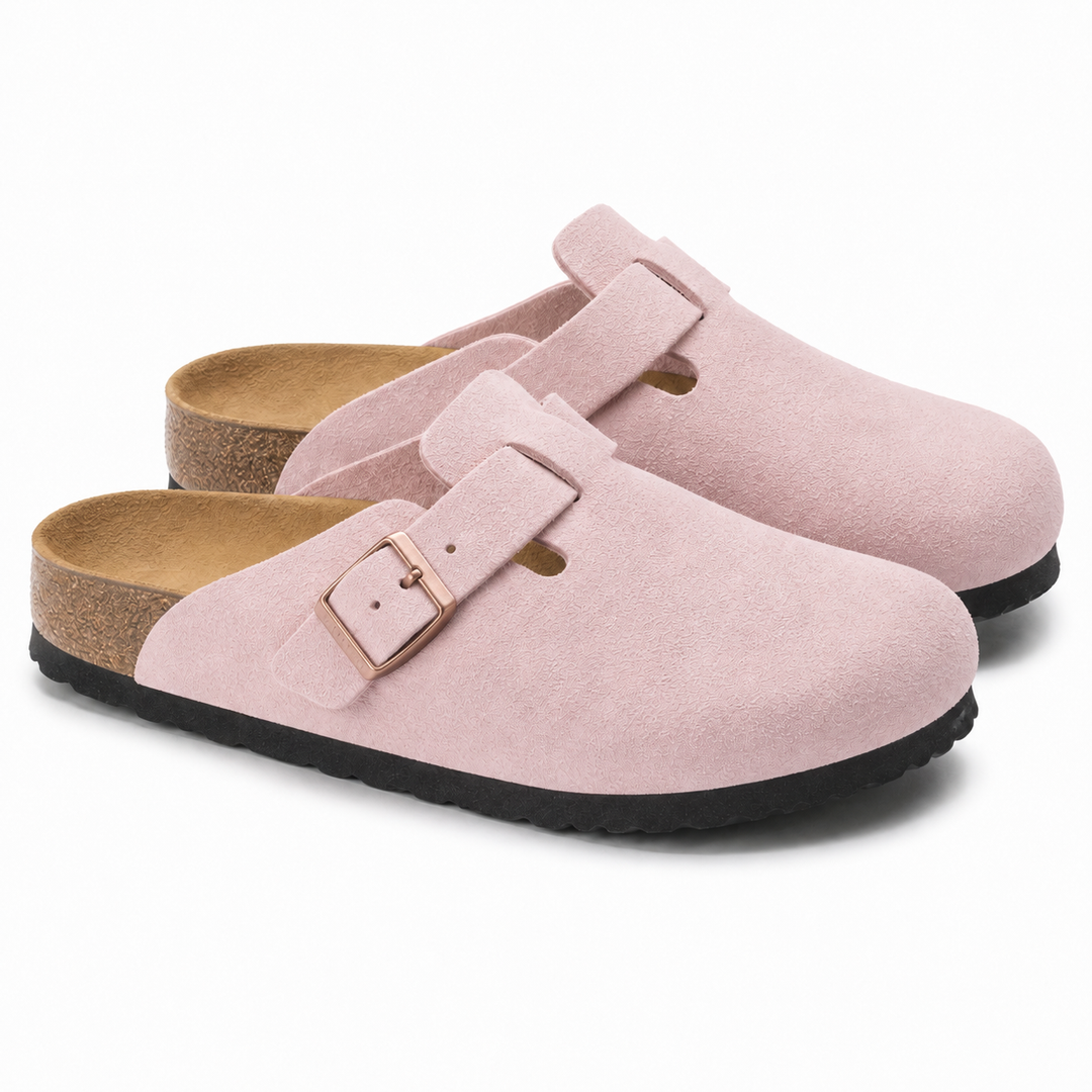 Unisex Positano clog mule with buckle strap, cork insole and black padded sole, shown in taupe and black.