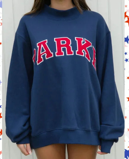 Woman wearing a pink cropped graphic sweatshirt and matching shorts set