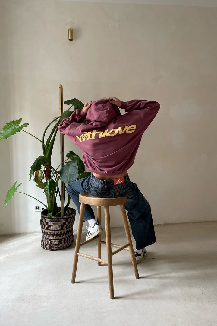 Women's hooded sweatshirt with chest graphics and kangaroo pocket