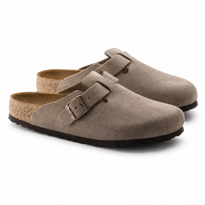 Unisex Positano clog mule with buckle strap, cork insole and black padded sole, shown in taupe and black.