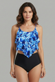 Woman wearing black ruffle tankini top with high-waist printed bottom