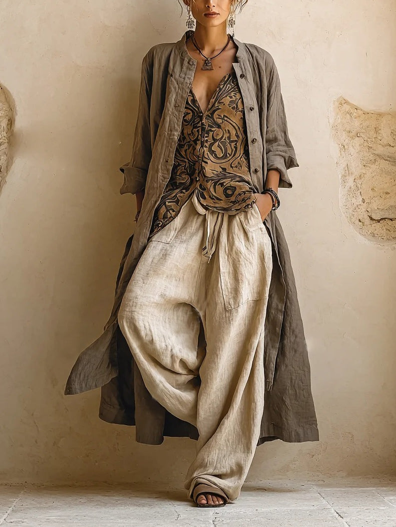 Women's three-piece set with grey-brown button shirt, patterned wrap top, and cream wide-leg trousers