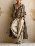 Women's three-piece set with grey-brown button shirt, patterned wrap top, and cream wide-leg trousers