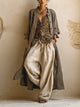Women's three-piece set with grey-brown button shirt, patterned wrap top, and cream wide-leg trousers