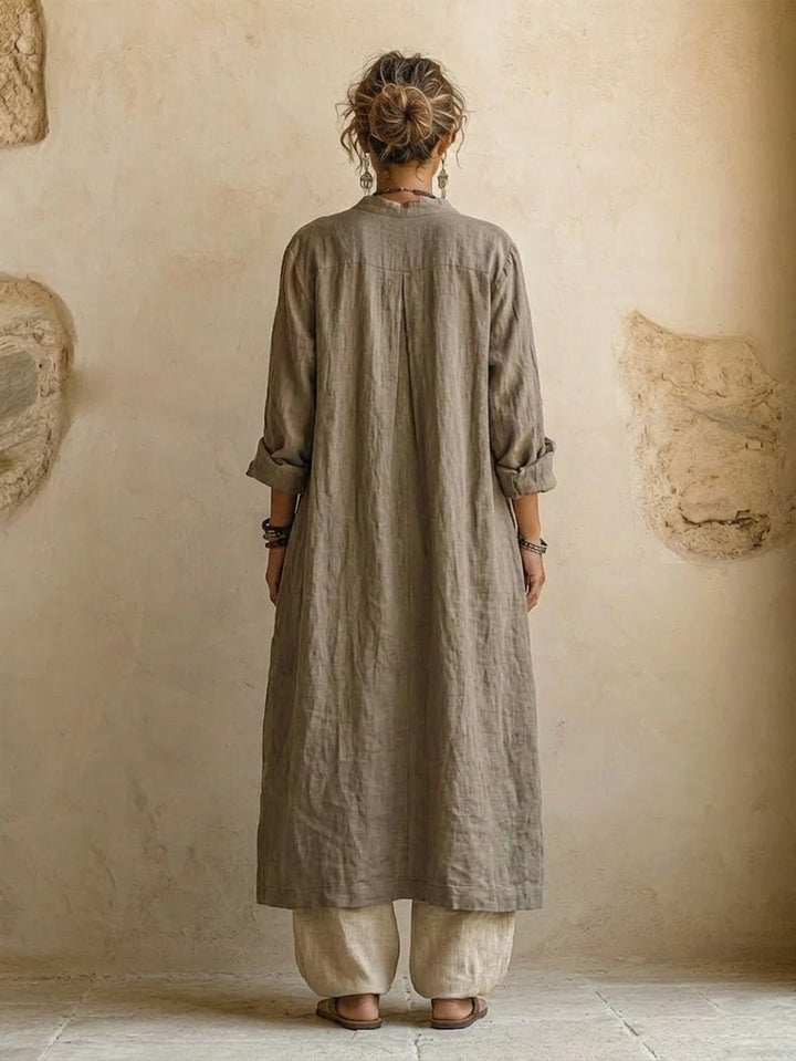 Women's three-piece set with grey-brown button shirt, patterned wrap top, and cream wide-leg trousers