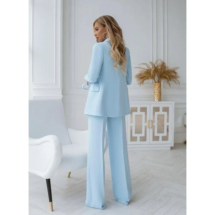 Women's light blue two-piece blazer suit with double-breasted jacket and straight trousers