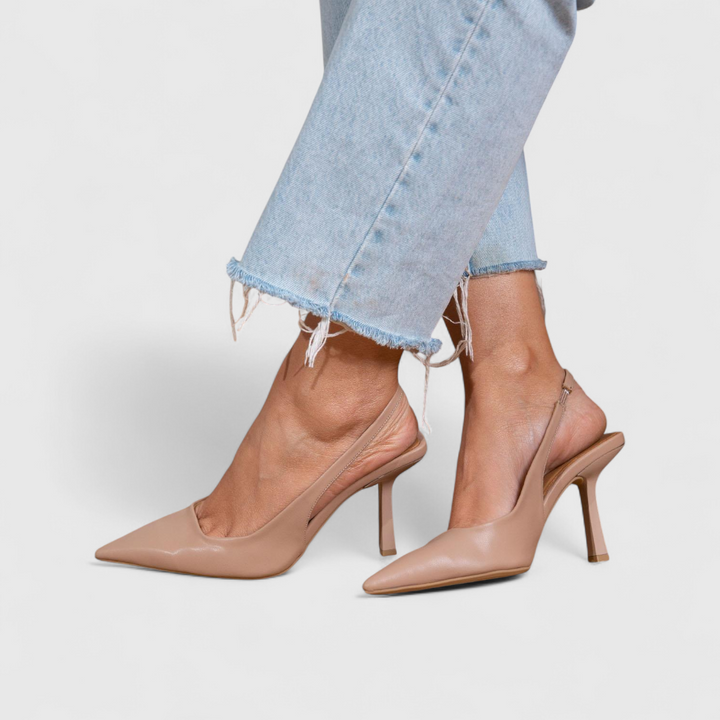Women's beige pointed-toe slingback heels with thin stiletto heel